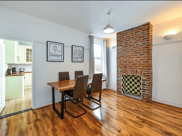Another fireplace sits in the dining room area, which leads into the kitchen