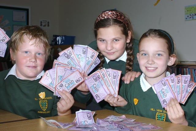 It's the Cash For School's voucher programme in 2009 and these pupils - Aaron Curle, Melissa Burton and Bethany McNab - were doing their bit to support it.