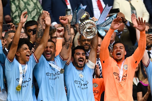Man City lift the FA Cup following their 2-1 win over Man Utd at Wembley