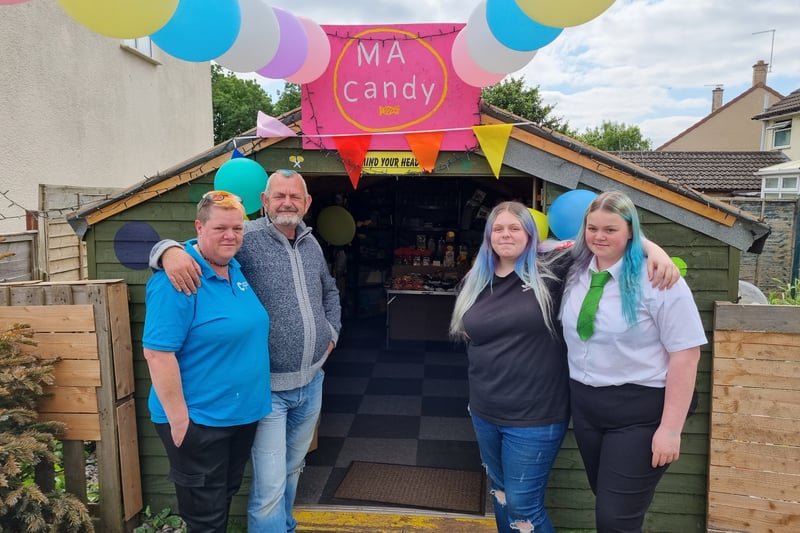 Alison, Mike, Tyra and Iona Hazzard at the entrance to their sweet shop MA Candy in Brislington