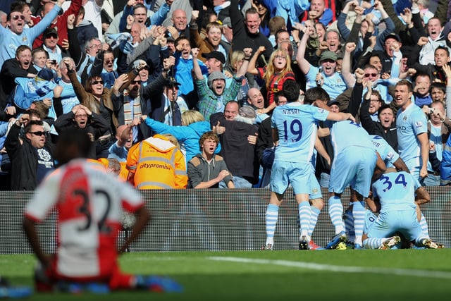 Sergio Aguero is swamped by his team mates after scoring the goal which clinched man City the title in 2012