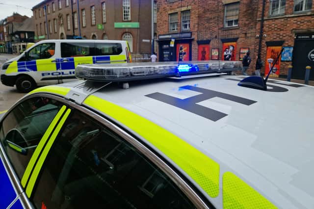 Five people have been charged in a burglary "crackdown" by South Yorkshire Police. File picture shows South Yorkshire Police vehicles on West Street, Sheffield.