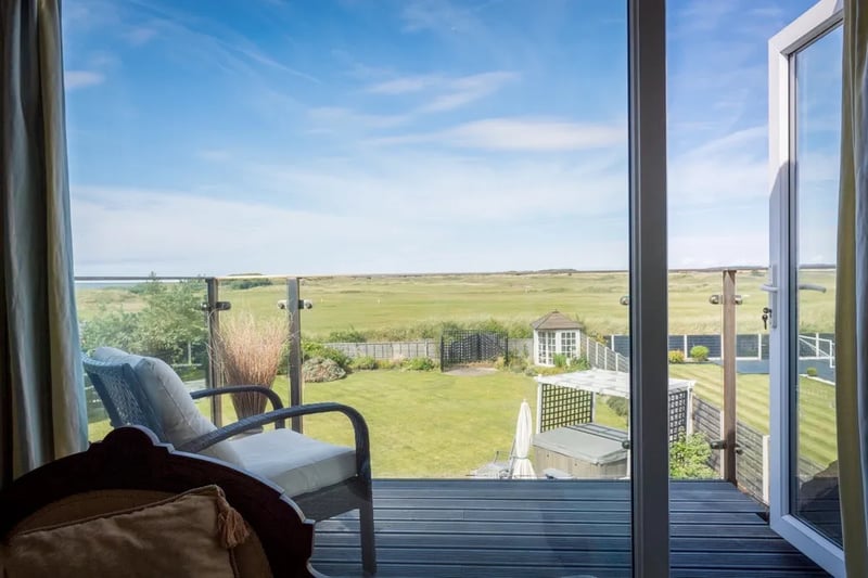 Who wouldn’t want to relax with a book and a beverage  here? The property is next to West Lancashire Golf Club and features astonishing views of the course along with the sea beyond.