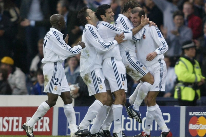 Real Madrid celebrate with Zinedine Zidane after he scored their second goal to make it 2-1. The sublime volley was voted as the most beautiful goal in Champions League history by France Football. 