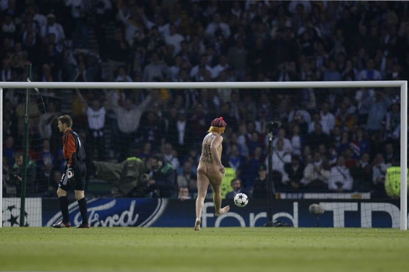 A streaker runs across the pitch to score a goal during the Champions League final. 