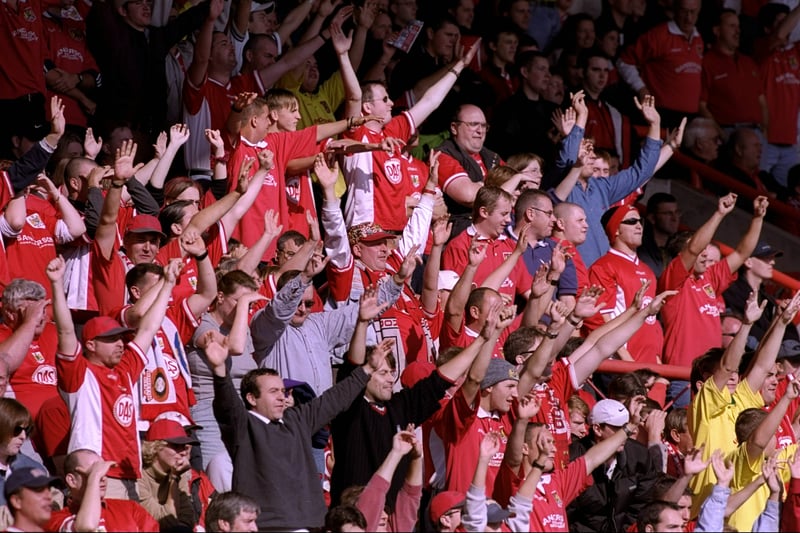 Bristol City fans cheer on their team in the Bristol Derby in October 1999. It was a goalless draw at Ashton Gate. 