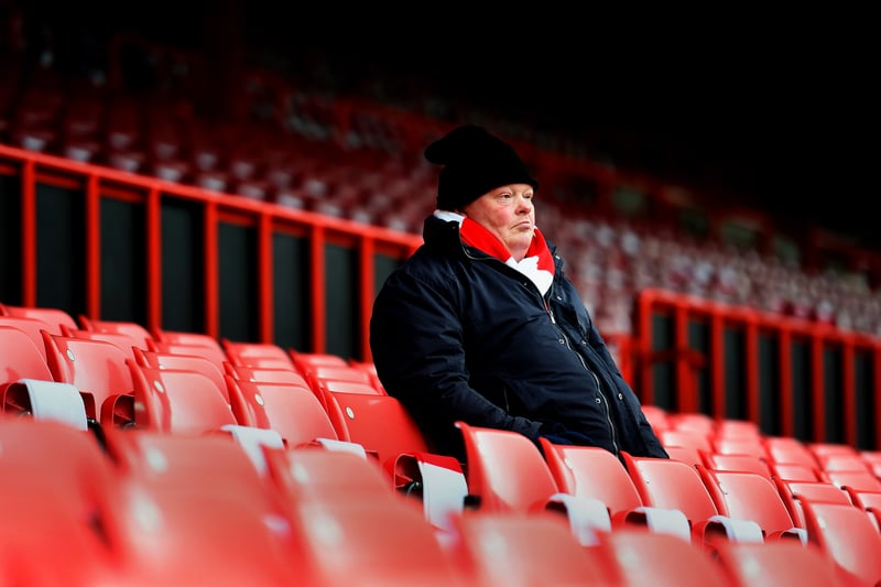 A Bristol City fan on his own takes his seat, ahead of their FA Cup clash with West Ham.