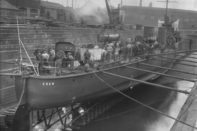 Stern view of HMS Eden in dry dock at the Hawthorn Leslie shipyard, Hebburn, 1903 (TWAM ref. 2931 Misc59).     HMS Eden was a River Class destroyer, launched by Hawthorn Leslie on 13 March 1903. She was lost on 18 June 1916 after a collision with the ocean liner SS France in the Channel.