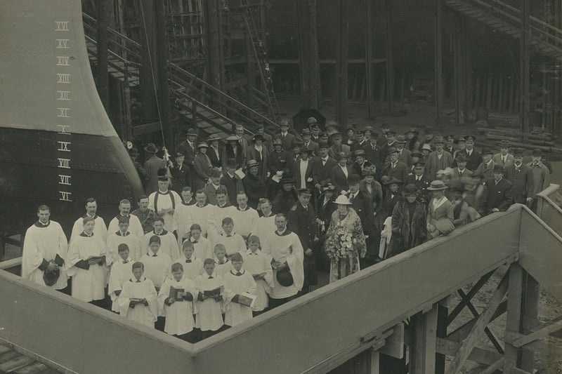 Launch party of HMS Champion, launched by Lady Cynthia Asquith at the Hebburn shipyard of Hawthorn Leslie, 29 May 1915 (TWAM ref. 4923/2). Have you noticed a few uninvited guests in the background. sneaking into the photo?     HMS Champion was a C-class light cruiser and one of the first vessels of the Light Cruiser Squadron in action at the Battle of Jutland.