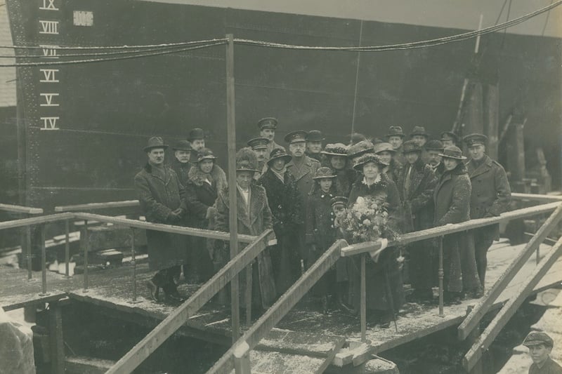Launch party of the destroyer HMS Thisbe, launched at the Hebburn shipyard of Hawthorn Leslie, 8 March 1917. A lovely wintry scene. Looks like a young apprentice has got himself into the photo - an early example of photobombing.