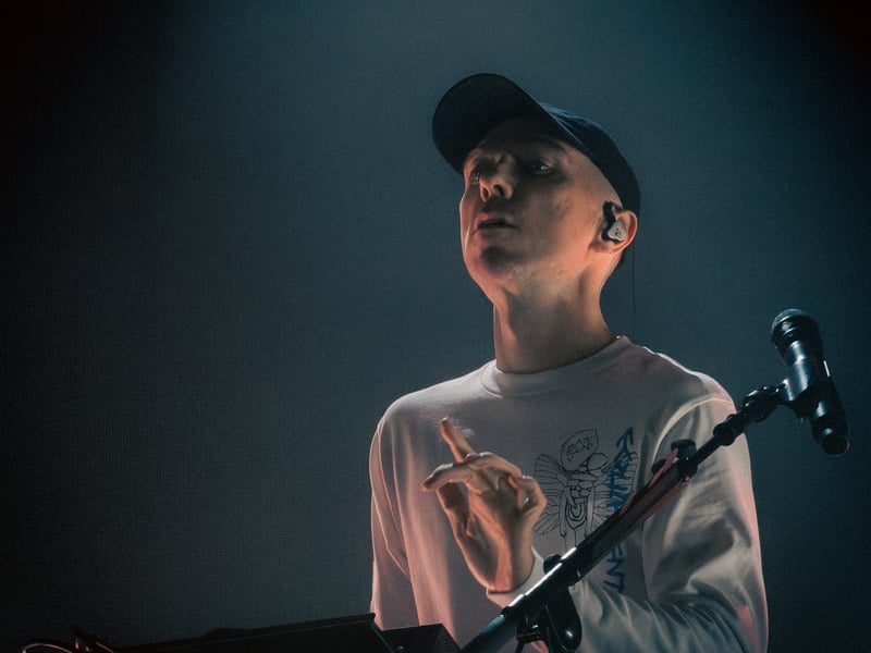 Martin Doherty mid-set for CHVRCHES. Doherty plays keyboards, sampler, guitar and performs main vocals and backing vocals. He also contributes to CHVRCHES’ songwriting and production.