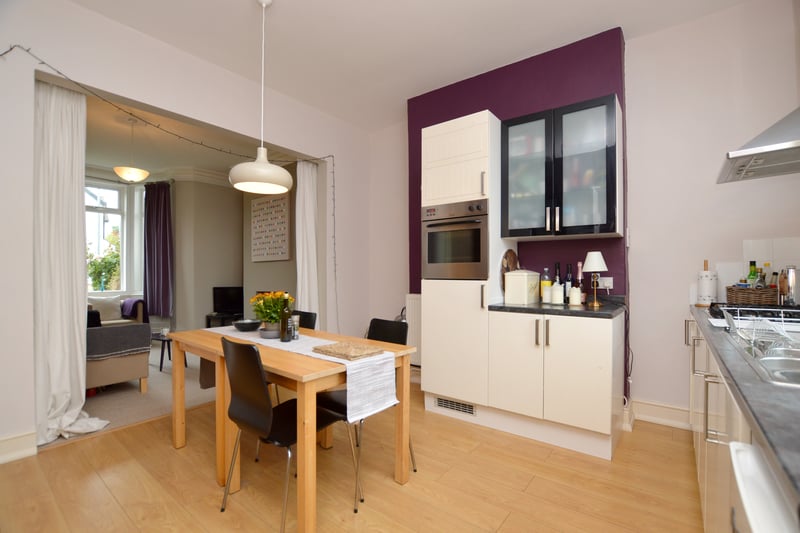 The spacious dining kitchen with access to the living room.