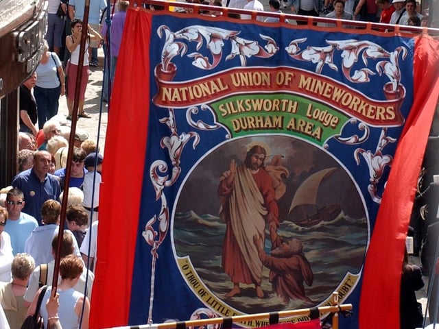 Silksworth Lodge banner bathed in the 2003 sunshine as it passes the Magdalene Steps.