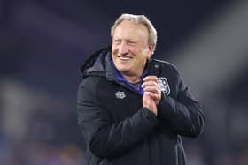 Neil Warnock led Huddersfield  out of relegation and has now decided to stay on at the Terriers