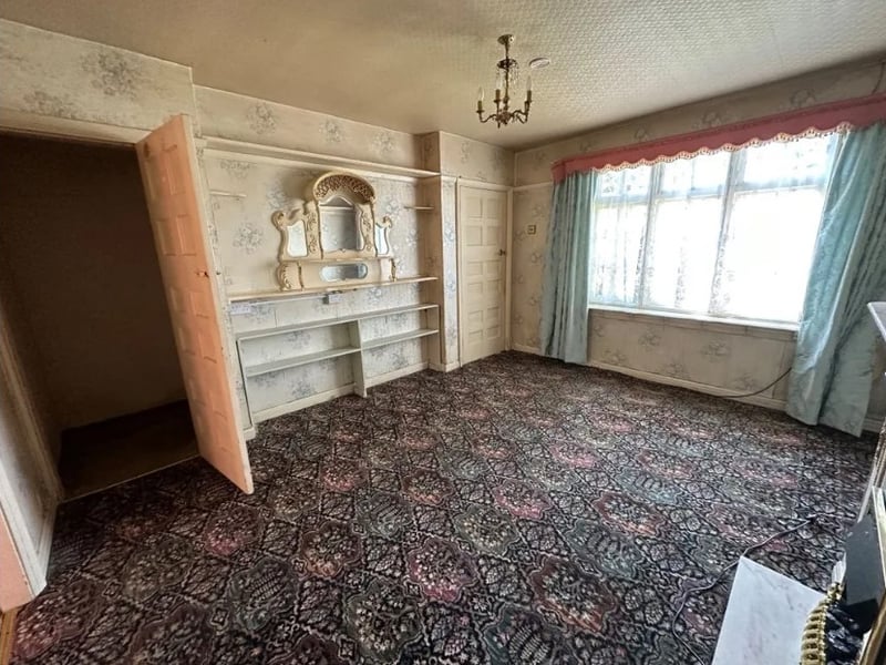 The living room is a great size and a large window lets in lots of sun light