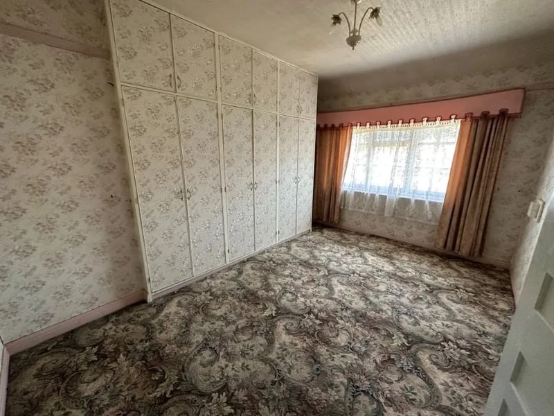 The second bedroom has large fitted wardrobes