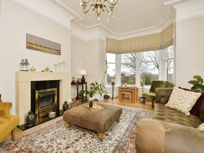 The sitting room is located at the front of the property.