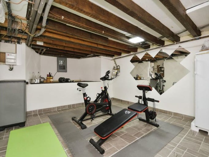 The gym is found in the property's cellar.