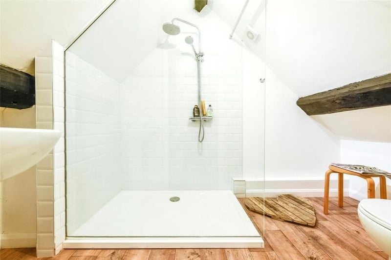 The property boasts two bathrooms, including this spa-like en-suite which would no doubt be the perfect place to unwind at the end of a long day.