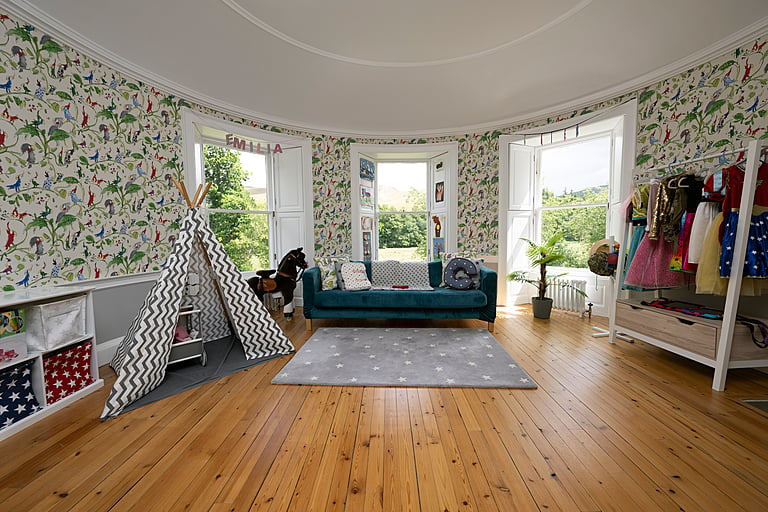The home is decorated with glorious and colourful wallpaper throughout.
