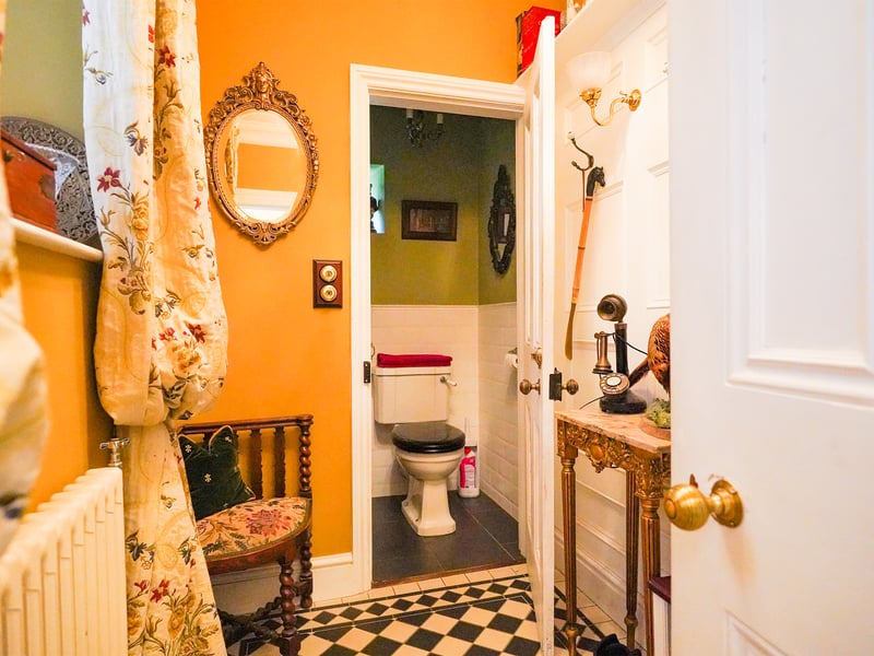 Just left of the front door is a cloakroom, which leads through to a downstairs w.c.