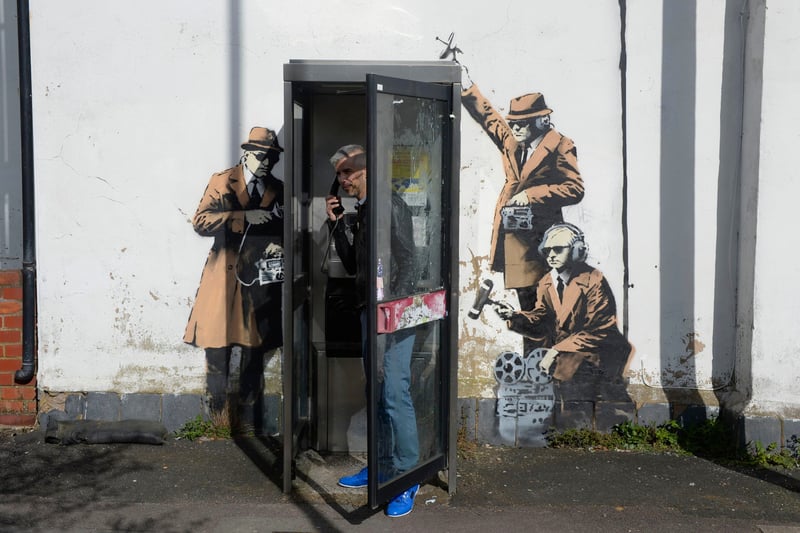First spotted in Cheltenham, England, ‘Spy Booth’ shows three government noir-style spies who are perched around a telephone booth using 1950s surveillance equipment to eavesdrop on the user’s conversation within. The art was reportedly in close proximity to the Government Communications Headquarters (GCHQ) which is tasked with sending information to the British Government and Armed Forces.