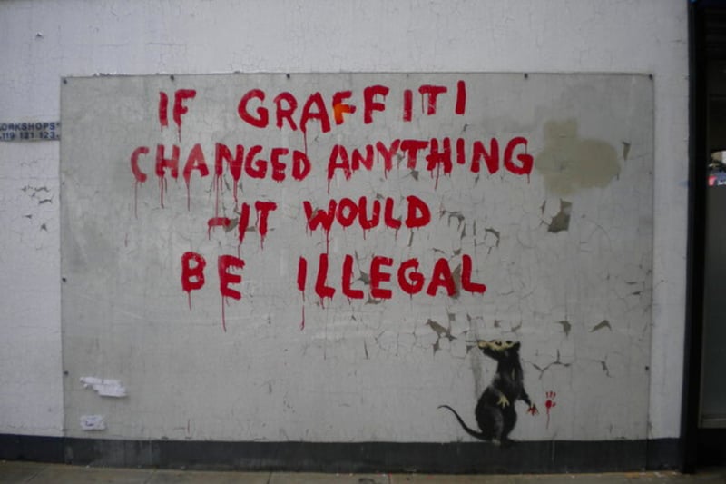 This art was unveiled on a wall on Clipstone Street (Fitzrovia) where it reportedly appeared overnight on Easter Monday. The message “If graffiti changed anything, it would be illegal” is thought to be a reference to the words of 20th century activist Emma Goldman who said: “If voting ever changed anything, it would be illegal”.