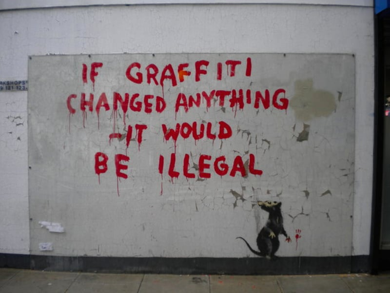 This art was unveiled on a wall on Clipstone Street (Fitzrovia) where it reportedly appeared overnight on Easter Monday. The message “If graffiti changed anything, it would be illegal” is thought to be a reference to the words of 20th century activist Emma Goldman who said: “If voting ever changed anything, it would be illegal”.