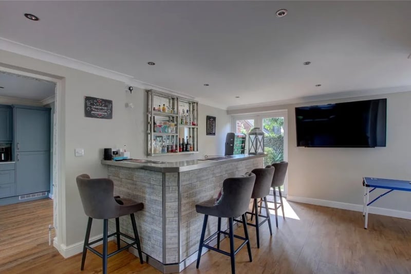 A downstairs family room has been turned into a bar area