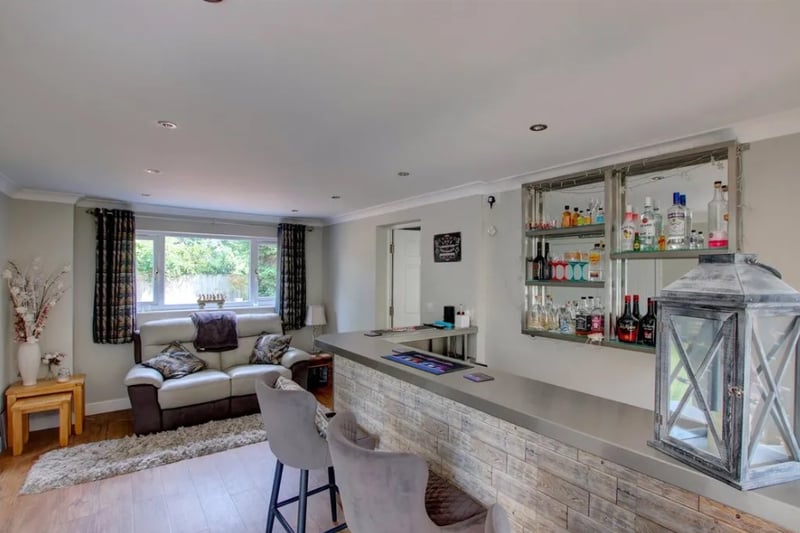 The bar area is the perfect place for entertaining guests when the weather is warm