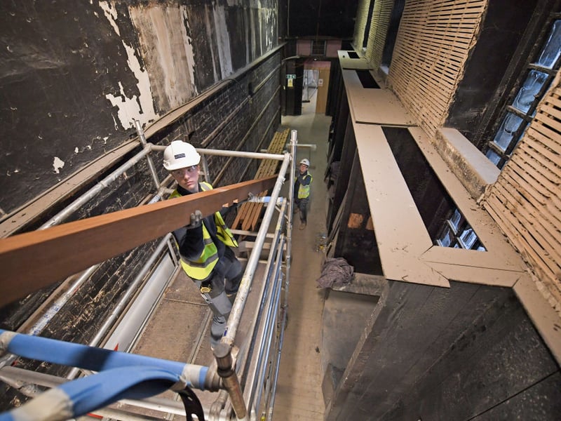 Specialist carpenters from Lawrence McIntosh install the floor to the bookstore above the Mackintosh Library on November 22, 2017.