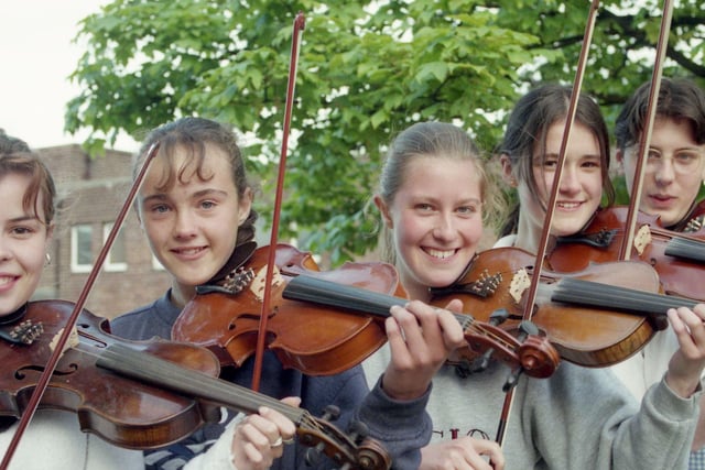 Violinists Anna Scott, Laura Davies, Marian Coutts, Linden Townson, and Chris Hounslow were part of a musical initiative in 1996.