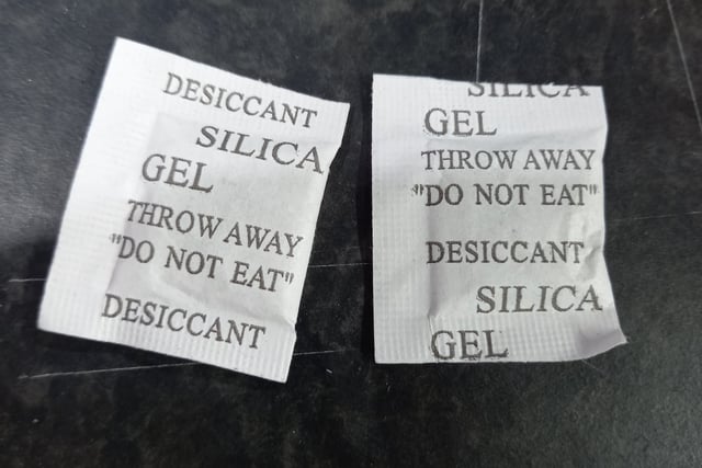 The small silica gel packs that come with new shoes or in some packaging can be used inside sweaty trainers or wellies for absorbing moisture and possibly lessen any bad smell. 
Keep away from small children.