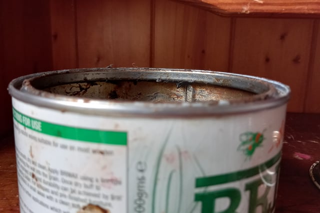 Don't waste the furniture wax under the rim of the tin. 
Either use an old, dry washing up sponge to get it, or a flat head screwdriver to scrape it off and use it, then wipe the screwdriver. It's amazing how much is left under the edge of the tin.