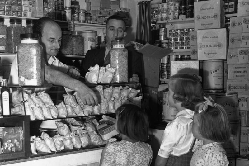 Children buying sweets at a shop in New Eltham, in 1949, on the last day before they went back on the ration.  (Photo by Warburton/Topical Press Agency/Getty Images)