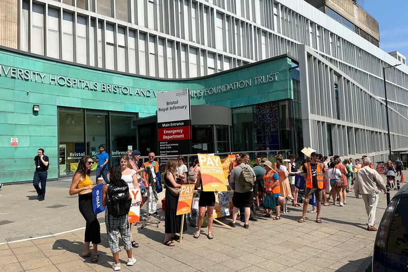 Junior doctors stand at the picket line outside Bristol Royal Infirmary as they take part in a three-day strike over pay. The group held up their banners as motorists sounded horns as they went by.
