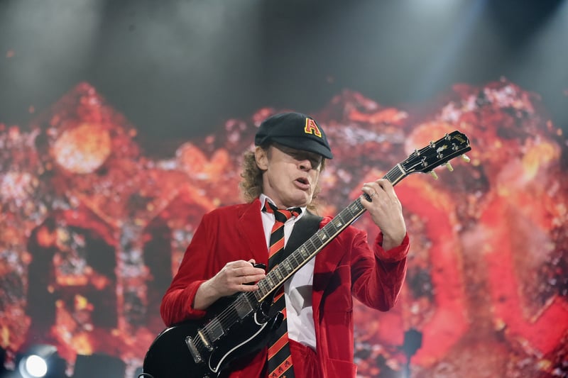 The only remaining original member of the hard rock band AC/DC, Young  is known for his energetic performances and schoolboy-uniform stage outfits. A famous collector of Rangers Strips.