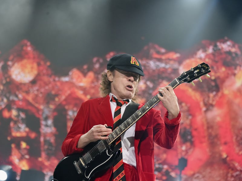 The only remaining original member of the hard rock band AC/DC, Young  is known for his energetic performances and schoolboy-uniform stage outfits. A famous collector of Rangers Strips.