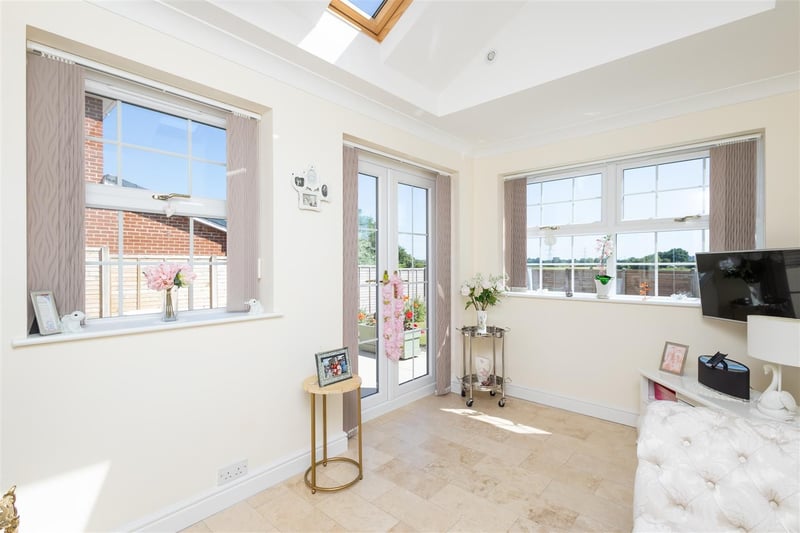 The sun room can be used for whatever suits your needs and has French doors leading to the rear garden.