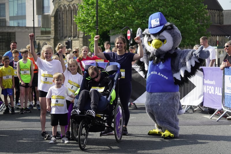 Rob Burrow MBE along with family and the Arena owl.  Photo: Run For All