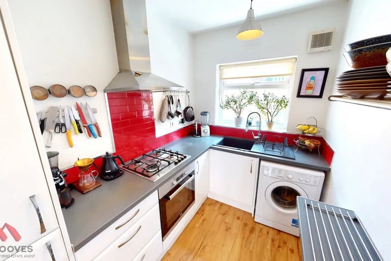 “The kitchen is fully fitted with a range of wall and floor units and integrated appliances consisting of an oven, hob, extractor, fridge/freezer and sink with drainer.”