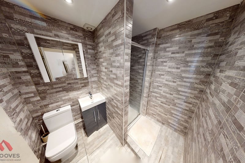 “The bathroom is fully tiled with a main fed shower cubicle, low level w/c and hand wash basin.”