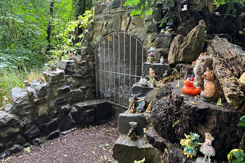 The main feature of the fairy woodland is this incredible grotto within a small gated cave with hundreds of figures inside. Around it are sculptures with everything from owls to foxes to plastic ducks! 
