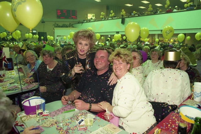 Coronation Street actress Barbara Knox at the newly refurbished Gala Bingo in 1992. 
The star, who plays Rita Fairclough, was pictured with Phyliss and David Longstaff.