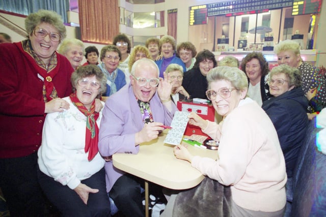 Coronation Street's Reg Holdsworth - played by Ken Morley - visited the Regal bingo at Concord, Washington in 1994. He checked Kathleen Gibson's card. watched by Regal regulars.