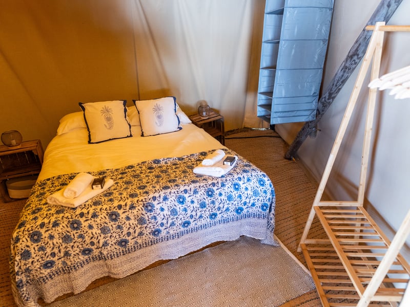 The double bed inside the premium tent