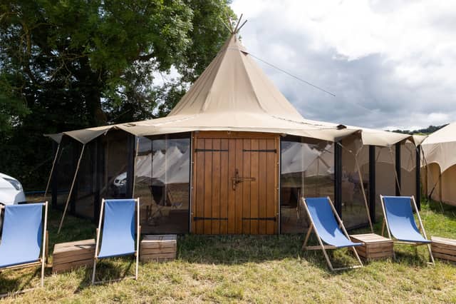 Inside the premium £24,000 'tent' - complete with nearby swimming pool & dining lounge
