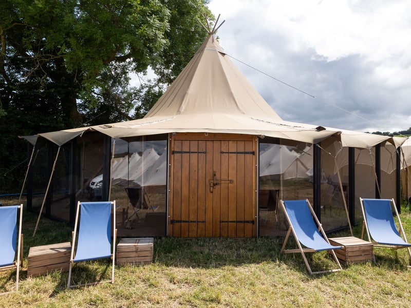 Inside the premium £24,000 'tent' - complete with nearby swimming pool & dining lounge