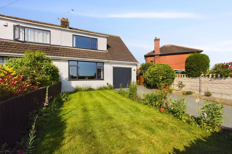A large lawn on the front of the property. Photo: Zoopla
