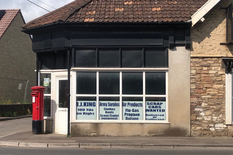 This empty shop on the main road through Farrington Gurney advertises a range of products and services including army surplus equipment